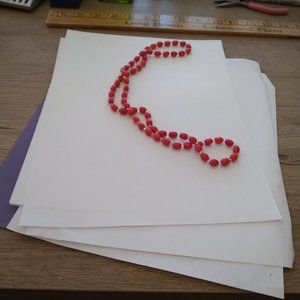 Red egg style linked beads 60 inch mardi gra red resin party beads